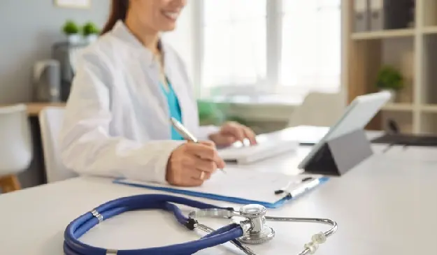 Doctor working in a laptop